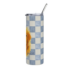 A tall, skinny tumbler with a clear lid and glass straw, featuring a blue and white checkered pattern with a partial yellow sunflower graphic on the side.