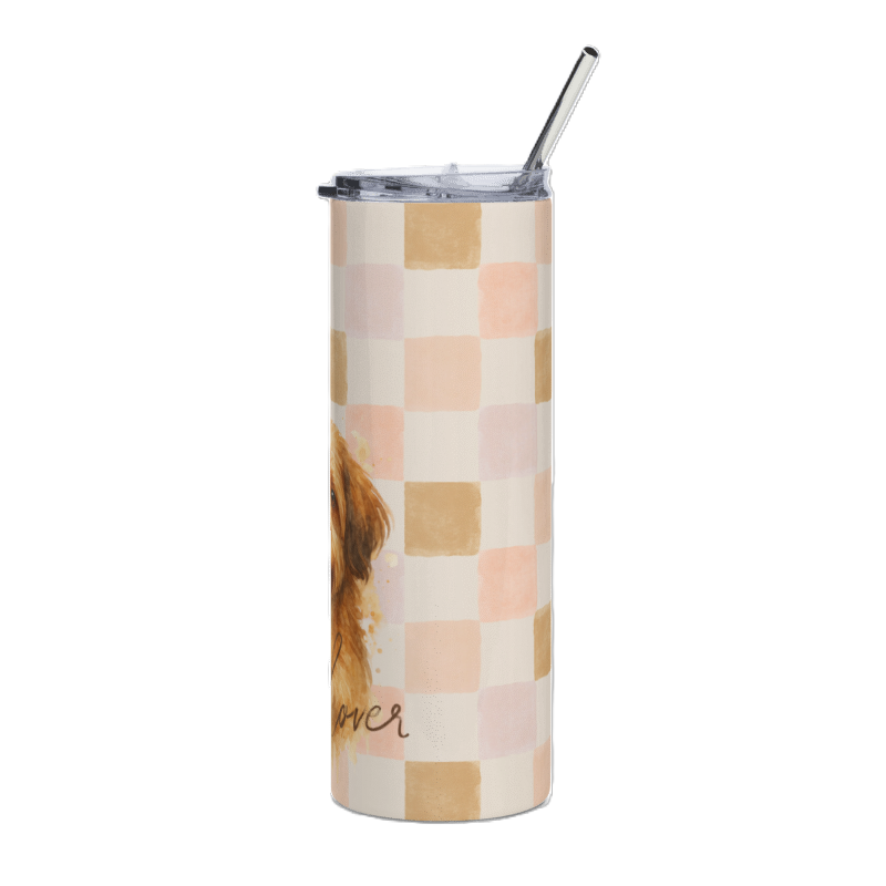 A tall insulated tumbler with a clear lid and metal straw, featuring a pastel checkerboard pattern in peach, beige, and cream, with part of a brown dog illustration and the word 'ever' visible on the lower left.