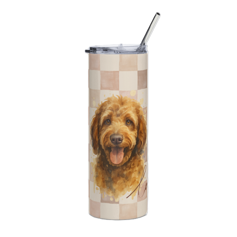 A tall insulated tumbler with a clear lid and metal straw, featuring a printed watercolor-style portrait of a golden dog on a beige and tan checkerboard background.
