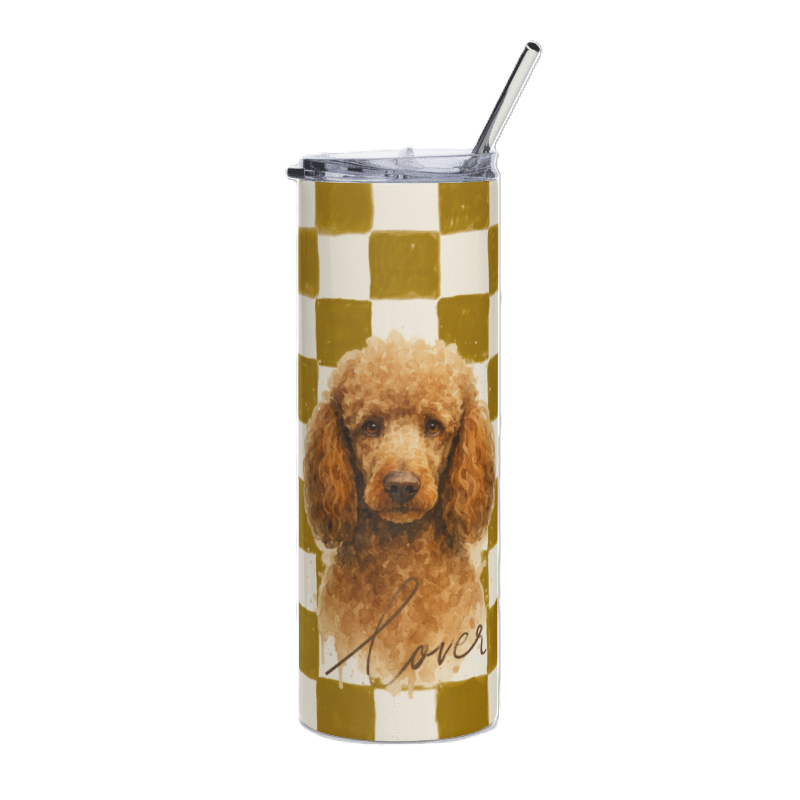 A tall insulated tumbler with a clear lid and metal straw, featuring a printed design of a brown poodle over a mustard and cream checkered pattern, with the word 'lover' in script near the bottom.