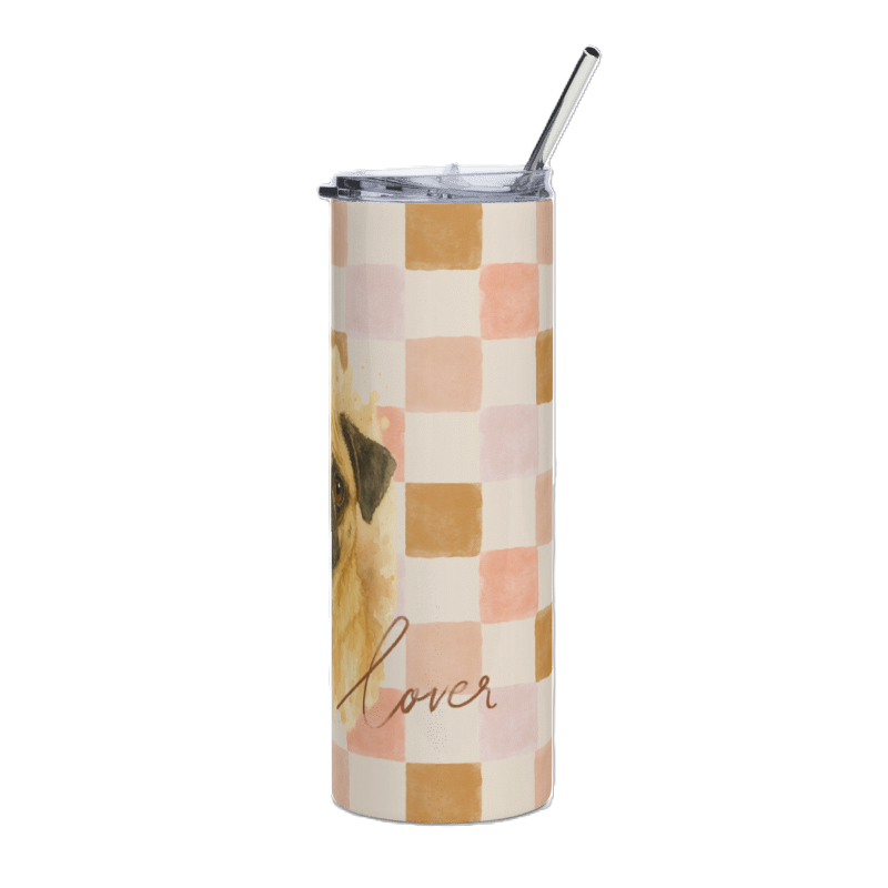 A tall insulated tumbler with a clear lid and metal straw, featuring a watercolor-style dog illustration and a pastel checkerboard pattern in pink, peach, tan, and cream, with the word 'lover' in script near the bottom.
