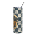 A tall insulated tumbler with a clear lid and metal straw, featuring a distressed black and white checkerboard pattern and a partial graphic of a dog on the side.