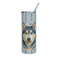 A tall insulated tumbler with a clear lid and metal straw, featuring a watercolor-style husky dog portrait on a pale blue and white striped background.