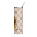 A tall insulated tumbler with a clear lid and metal straw, featuring a beige and blush pink checkerboard pattern, a partial watercolor dog illustration, and the word 'lover' in script near the bottom.
