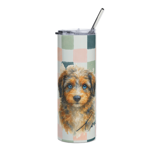 A tall insulated tumbler with a clear lid and metal straw, featuring a printed watercolor-style aussie doodle dog portrait over a pastel check pattern on a white background.