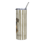 A tall, clear insulated tumbler with a clear lid and metal straw, featuring a vertical beige and white stripe pattern and part of a dog illustration on the side.
